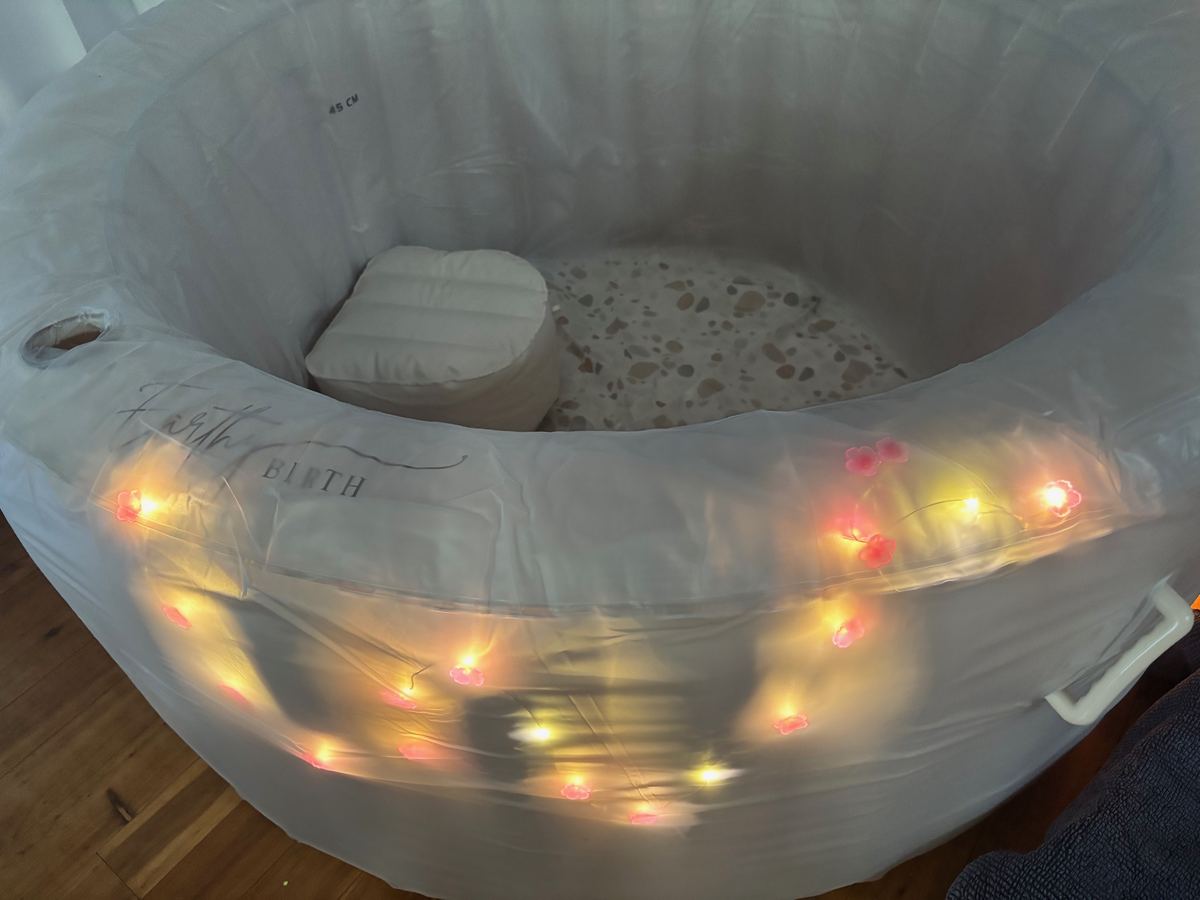 Fresh sealed liner inside a birth pool, with terrazzo-pattern base